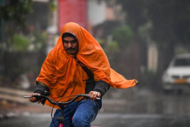 NOIDA, INDIA - DECEMBER 27: Commuters during winter rain in Sector 12, rain adds to severe cold wave in North India Several parts of Delhi-NCR received rainfall in the morning, on December 27, 2024 in Noida, India. Delhi and nearby areas received mod clipart