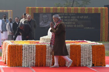 NEW DELHI, INDIA - DECEMBER 25, 2024: Prime Minister Narendra Modi pays tribute to former prime minister Atal Bihari Vajpayee on his birth anniversary, at Sadaiv Atal, Rajghat, on December 25, 2024 in New Delhi, India. clipart