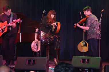 NEW DELHI, INDIA: DECEMBER 13, 2024 - Irish Singer Aoife Scott and her band members Andy Meaney and Cathal Currin perform during the Christmas dinner reception at Embassy of Ireland. Photo by Manoj Verma Hindustan Times clipart