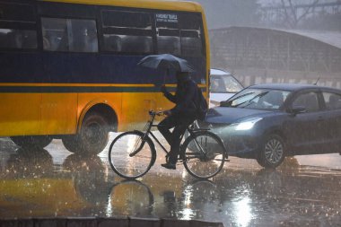 GURUGRAM INDIA DECEMBER 27 2024 People going to their workplace amid rain on a winter morning at Rajiv chowk near district court on December 27 2024 in Gurugram India Delhi and nearby areas received moderate to heavy rain on Friday leading to a drop  clipart