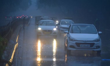 NEW DELHI INDIA DECEMBER 27 2024 Commuters out in cold and rainy weather morning at Connaught Place Circle on December 27 2024 in New Delhi India Delhi and nearby areas received moderate to heavy rain on Friday leading to a drop in temperatures The I clipart