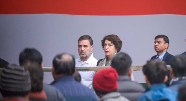 NEW DELHI INDIA DECEMBER 28 2024 Congress Leader Rahul Gandhi along with Priyanka Gandhi Vadra arrives as Mortal remains of former prime minister Manmohan Singh being taken to Congress headquarters for congress party leaders and workers to pay their  clipart