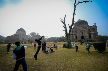 NEW DELHI INDIA DECEMBER 29 2024 People enjoying as the weather gets cleared after two days of rains in National capital at Lodhi Garden on December 29 2024 in New Delhi India North India is reeling under cold weather with temperatures plummeting acr clipart