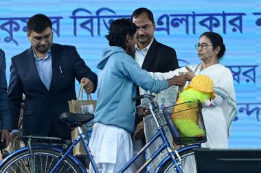 SANDESHKHALI INDIA DECEMBER 30 2024 Chief Minister Mamata Banerjee distributes various governments schemes to the people of Sandeshkhali during an Adminstrative Meeting in North 24 Parganas on December 30 2024 in Sandeshkhali India Almost a year afte clipart