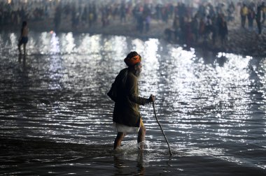 PRAYAGRAJ INDIA DECEMBER 30 2024 A sadhu can see movingat the Sangam on December 30 2024 in Prayagraj India The next Maha Kumbh Mela will take place in Prayagraj from January 13 to February 26 2025 clipart