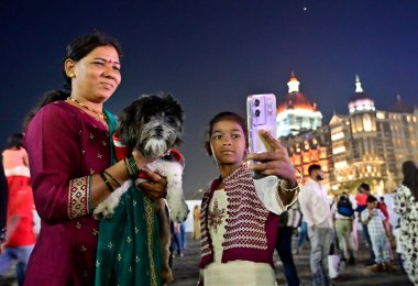 MUMBAI, INDIA - DECEMBER 31: Ulwe resident Sangeeta Gauda along with her 1 year 