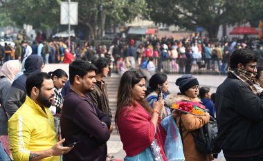 NEW DELHI, INDIA - JANUARY 1: Devotees in long queue wait to pay obeisance at the Hanuman Mandir on the first day of the year 2025, at Connaught Place on January 1, 2024 in New Delhi, India clipart