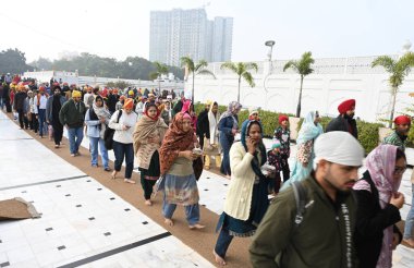 NEW DELHI, INDIA - JANUARY 1, 2025: Devotees visit Bangla Sahib gurudwara to offer prayers on the first day of New Year 2025, on January 1, 2024 in New Delhi, India. (Photo by Sonu Mehta/Hindustan Times) clipart