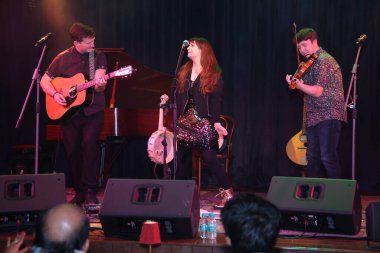 NEW DELHI, INDIA: DECEMBER 13, 2024 - Irish Singer Aoife Scott and her band members Andy Meaney and Cathal Currin perform during the Christmas dinner reception at Embassy of Ireland. Photo by Manoj Verma Hindustan Times clipart