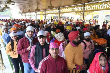 NEW DELHI, INDIA - JANUARY 1, 2025: Devotees visit Bangla Sahib gurudwara to offer prayers on the first day of New Year 2025, on January 1, 2024 in New Delhi, India. (Photo by Sonu Mehta/Hindustan Times) clipart