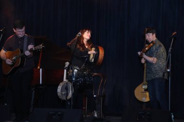 NEW DELHI, INDIA: DECEMBER 13, 2024 - Irish Singer Aoife Scott and her band members Andy Meaney and Cathal Currin perform during the Christmas dinner reception at Embassy of Ireland. Photo by Manoj Verma Hindustan Times clipart