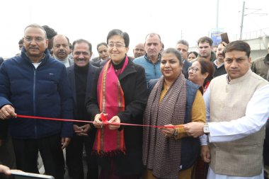 NEW DELHI INDIA JANUARY 2 2025 Delhi Chief Minister Atishi with MLA Girish Soni and UT Assembly Dy Speaker Rakhi Birla during the inauguration of the Punjabi Bagh Club Road 6 lane Flyover on January 2 2025 in New Delhi clipart