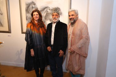 NEW DELHI, INDIA - NOVEMBER 28, 2024: Alison Barett (L) and Designer Oroon Das (C) during the opening of artist Sujata Deres exhibition Earth Song at Visual Arts Gallery in India Habitat Centre, on November 28, 2024 in New Delhi, India. clipart