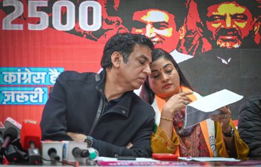 NEW DELHI INDIA JANUARY 6 2025 Devender Yadav President of Delhi Pradesh Congress Committee along with Congress leader Alka Lamba during the launch of Pyari Didi Scheme ahead of Delhi Vidhan Sabha Elections at DPCC Headquarters on January 6 2025 in N clipart