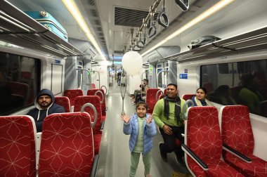 NEW DELHI INDIA JANUARY 5 2025 People take a ride at New Ashok Nagar station after Prime Minister Narendra Modi inaugurated a 13 km section of the Delhi Meerut Regional Rapid Transit System RRTS corridor Namo Bharat train on Sunday connecting Sahibab clipart