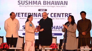 NEW DELHI INDIA JANUARY 4 2025 Union Home Minister & Minister of Cooperation Amit Shah along with LG Delhi VK Saxena and MP Bansuri Swaraj and others heading over room keys to a working women after inaugurating Sushma Swaraj Bhawan Working Women Host clipart