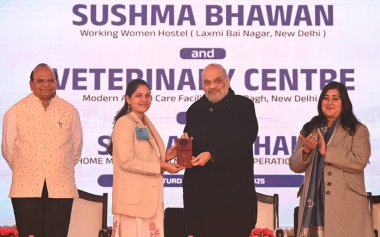 NEW DELHI INDIA JANUARY 4 2025 Union Home Minister & Minister of Cooperation Amit Shah along with LG Delhi VK Saxena and MP Bansuri Swaraj and others heading over room keys to a working women after inaugurating Sushma Swaraj Bhawan Working Women Host clipart