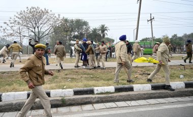 CHANDIGARH, INDIA, JANUARY 7 ,2025 Police personnel detain the Gurcharan singh father of Jagatr singh hawara and others during the Kaumi Insaf Morcha protest at the Sector 43 52 dividing road on January 7 2025 in Chandigarh India Since February 2023  clipart