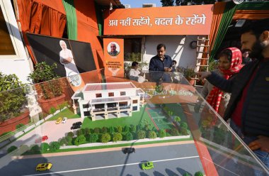 NEW DELHI INDIA JANUARY 8 2025 People view a model of Sheesh Mahal official residence of former Delhi CM Arvind Kejriwal displayed at the Delhi Pradesh BJP office on Pandit Pant Marg on January 8 2025 in New Delhi India BJP accuses Arvind Kejriwal of clipart