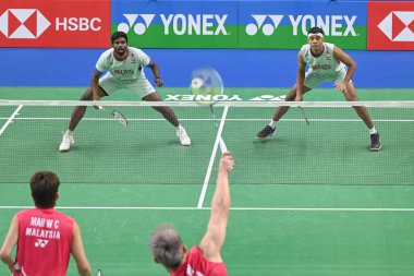 NEW DELHI INDIA JANUARY 14 2025 Satwiksairaj Rankireddy with Chirag Shetty from India competes during the Mens doubles match against Man Wei Chong and Tee Kai Wun from Malaysia at Yonex Sunrise India Open 2025 Badminton Tournament on January 14 2025  clipart