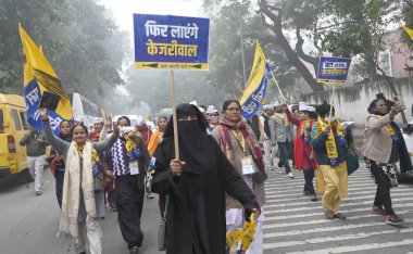 NEW DELHI INDIA JANUARY 15 2025 women supporters Participating with Aam Aadmi Party National Convener Arvind Kejriwal along with his wife Sunita Kejriwal participating Pad yatra for file Nomination Paper Aam Aadmi Party office Pt Ravi Shankar Shukla  clipart