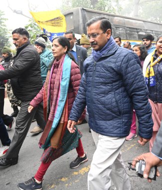 NEW DELHI INDIA JANUARY 15 2025 Aam Aadmi Party National Convener Arvind Kejriwal along with his wife Sunita Kejriwal participating Pad yatra for file Nomination Paper Aam Aadmi Party office Pt Ravi Shankar Shukla Lane to JamNagar SDM office on Janua clipart