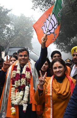 NEW DELHI INDIA JANUARY 15 2025 BJP candidate from New Delhi Assembly Parvesh Sahib Singh with His wife Swati Singh Verma and New Delhi MP Bansuri Swaraj going to file his nomination at Mansingh Road on January 15 2025 in New Delhi India Photo by Son clipart