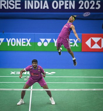 NEW DELHI INDIA JANUARY 16 2025 Satwiksairaj Rankireddy with Chirag Shetty from India competes during the Mens doubles match against Kenya Mitsuhashi and Hiroki Okamura from Japan at Yonex Sunrise India Open 2025 Badminton Tournament on January 16 20 clipart