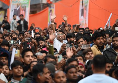 NEW DELHI INDIA JANUARY 23 2025 Massive crowds of BJP supporters seen during a public meeting of Uttar Pradesh Chief Minister Yogi Adityanath in support of BJP Candidate from Karol Bagh Dushyant Kumar Gautam for upcoming Vidhan Sabha Elections on Jan clipart