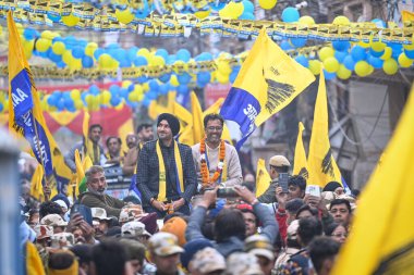 NEW DELHI INDIA JANUARY 27 2025 Harbhajan Singh Former Cricketer and Member of Parliament in Rajya Sabha seen along Vikas Bagga AAP Candidate from Krishna Nagar Assembly for upcoming Vidhan Sabha Elections during an election campaign in Krishna Nagar clipart