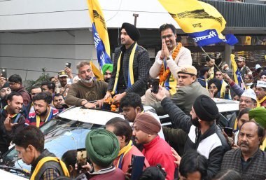 NEW DELHI INDIA JANUARY 27 2025 Former Indian cricketer and AAP Rajya sabha MP Harbhajan Singh roadshow for AAP Krishna Nagar assembly candidate Vikas Bagga for upcoming Delhi assembly elections at Radhey Shyam Park EXTN on January 27 2025 in New Del clipart