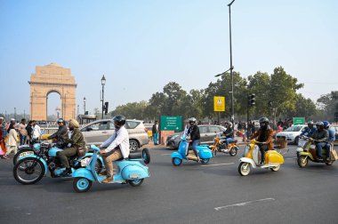 NEW DELHI INDIA FEBRUARY 2 2025 Vintage vehicles drive by District Election Office to promote Vintage Drive for Voter Awareness ahead of Delhi assembly election India Gate circle on February 2 2025 in New Delhi India The rally was flagged off from th clipart