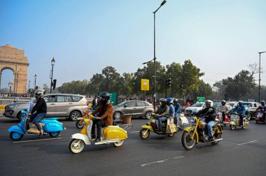 NEW DELHI INDIA FEBRUARY 2 2025 Vintage vehicles drive by District Election Office to promote Vintage Drive for Voter Awareness ahead of Delhi assembly election India Gate circle on February 2 2025 in New Delhi India The rally was flagged off from th clipart