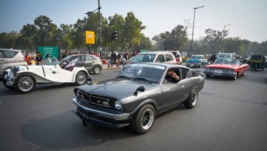 NEW DELHI INDIA FEBRUARY 2 2025 Vintage cars seen during Vintage Drive for voter awareness by Election Commission of India at India Gate on February 2 2025 in New Delhi India The rally was flagged off from the iconic Major Dhyan Chand National Stadiu clipart