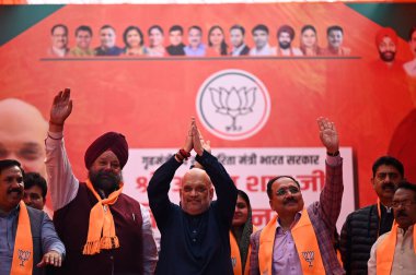 NEW DELHI INDIA FEBRUARY 3 2025 Union Home Minister Amit Shah during an election rally in favor of BJP Jagpura Candidate Tarvinder Singh Marwah at Bhagwan Nagar Market Jangpura on February 3 2025 in New Delhi India Amit Shah said Kejriwal lied to the clipart