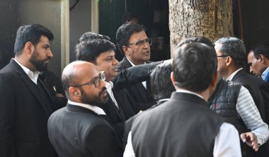 NEW DELHI, INDIA - FEBRUARY 7: AAP legal team talking with media persons during the Members of the Anti Corruption Bureau (ACB) arrive at the residence of AAP national convener Arvind Kejriwal after Delhi Lt Governor VK Saxena ordered a probe  clipart