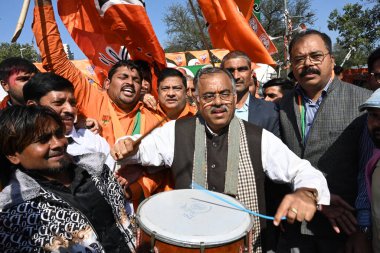 NEW DELHI, INDIA - FEBRUARY 8, 2025: BJP general secretary Tarun Chugh  with supporters and workers celebrate the party's win in the Delhi Assembly elections at Delhi BJP office, on February 8, 2025 in New Delhi, India. clipart