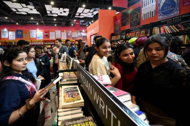 NEW DELHI, INDIA - FEBRUARY 9: People visit New Delhi World Book Fair organized by the National Book Trust, India, under the Ministry of Education, in collaboration with the India Trade Promotion Organisation clipart