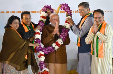 NEW DELHI, INDIA - FEBRUARY 8: Prime Minister Narendra Modi, BJP Delhi President Virendra Sachdeva, Delhi BJP Incharge Baijayant Panda, MP Manoj Tiwari, Bansuri Swaraj and others after victory over the Delhi assembly Elections 2025 at BJP HQ clipart