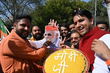 Bharatiya Janata Party (BJP) supporters and workers celebrate the party's win in the Delhi Assembly elections at Delhi BJP office, on February 8, 2025 in New Delhi, India. clipart