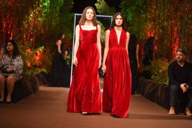 Models present creation by designer Payal Jain during a fashion show on the theme of Enchanted Forest at DLF Golf and Country Club on Golf Course Road near DLF Phase 5, on February 15, 2025 in Gurugram, India.  clipart