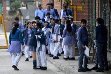 NEW DELHI, INDIA - FEBRUARY 15,2025: Students coming out from the exam centre after appearing the CBSE class 10th exam, at Bhartiya Vidya bhawan, KG Marg, on February 15, 2025 in New Delhi, India.  clipart