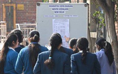 NEW DELHI, INDIA - FEBRUARY 15, 2025: Students of Modern school before appearing for the first CBSE class 10th board exam of English Subject at the examination centre Bharatiya Vidya Bhavan Mehta Viyalaya at KG Marg.  clipart