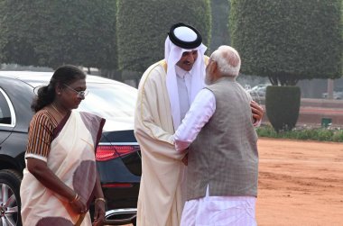 NEW DELHI, INDIA - FEBRUARY 18, 2025: President Droupadi Murmu and Prime Minister Narendra Modi with Emir of Qatar, Sheikh Tamim Bin Hamad Al-Thani during the latter's ceremonial welcome, at the Rashtrapati Bhavan. clipart