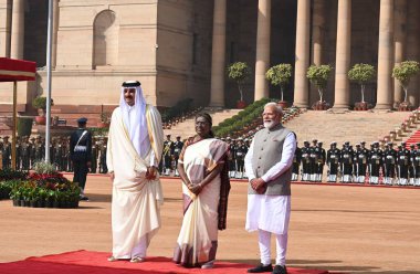 NEW DELHI, INDIA - FEBRUARY 18, 2025: President Droupadi Murmu and Prime Minister Narendra Modi with Emir of Qatar, Sheikh Tamim Bin Hamad Al-Thani during the latter's ceremonial welcome, at the Rashtrapati Bhavan. clipart