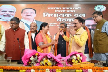 NEW DELHI INDIA FEBRUARY 19 2025 BJP MLA elect Rekha Gupta being congratulated by other party after her name was announced as Chief Minister of Delhi during BJP legislative party meeting at Delhi BJP office on February 19 2025 in New Delhi India Rekh clipart