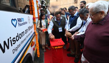 NEW DELHI INDIA FEBRUARY 21 2025 Union Education Minister Dharmendra Pradhan and vice chancellor DTU prof Prateek Sharma Paytm Foundation founder Vijay Shekhar Sharma and others inaugurating Wisdom on Wheels Bus mobile learning computer high speed Wi clipart