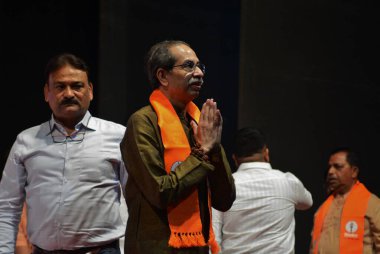 Shiv Sena UBT President Uddhav Thackray, MP Sanjay Raut and party leaders at the Shiv Sena UBT workers' rally at Kalidas Hall in Mulund in the backdrop of the upcoming municipal elections, on March 9, 2025 in Mumbai, India.  clipart