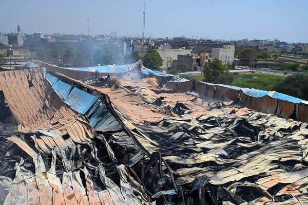 Fire service personnel are working to douse the fire that broke out at a factory warehouse and a beverage godown in Kadipur Industrial Area near Radha Soami Satsang Bhawan on Pataudi Road, on April 2, 2025 in Gurugram, India