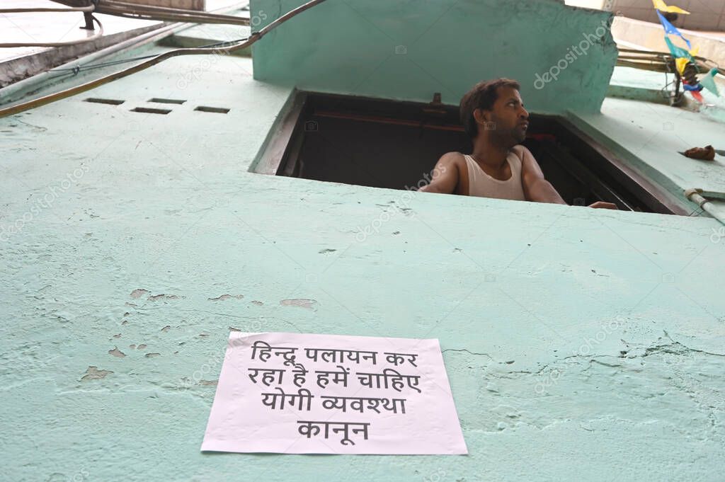 NEW DELHI INDIA APRIL 20 2025 A poster that reads Hindus are migrating Modi ji please help put up in Delhi s Seelampur area on April 20 2025 in New Delhi India According to police officials information about the stabbing incident was received at PS S